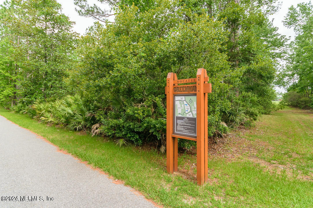 522 Old Bluff Drive Ponte Vedra, FL 32081 - Photo 92 of 93 a view of a wooden house with a big yard and large trees