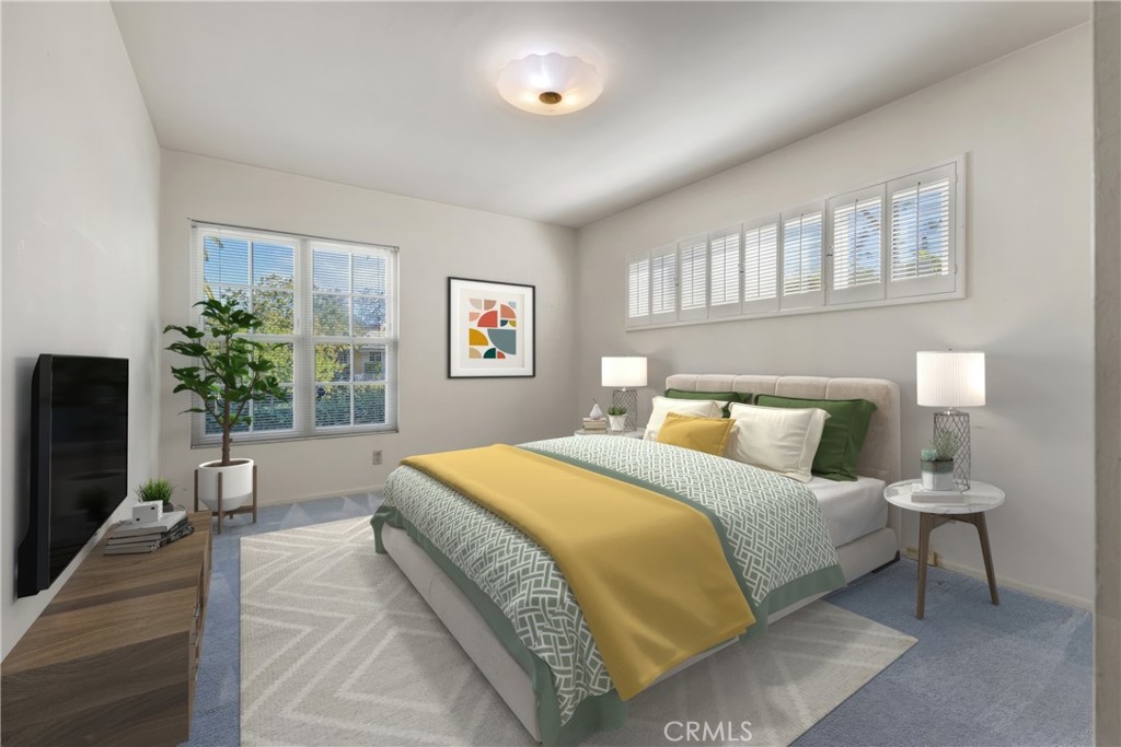 707 Luring Drive Glendale, CA 91206 - Photo 11 of 25 a bedroom with a large bed and a potted plant