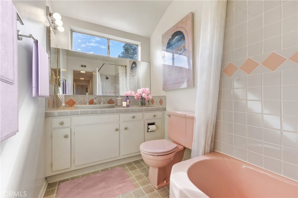 707 Luring Drive Glendale, CA 91206 - Photo 14 of 25 a bathroom with a sink a toilet and a mirror