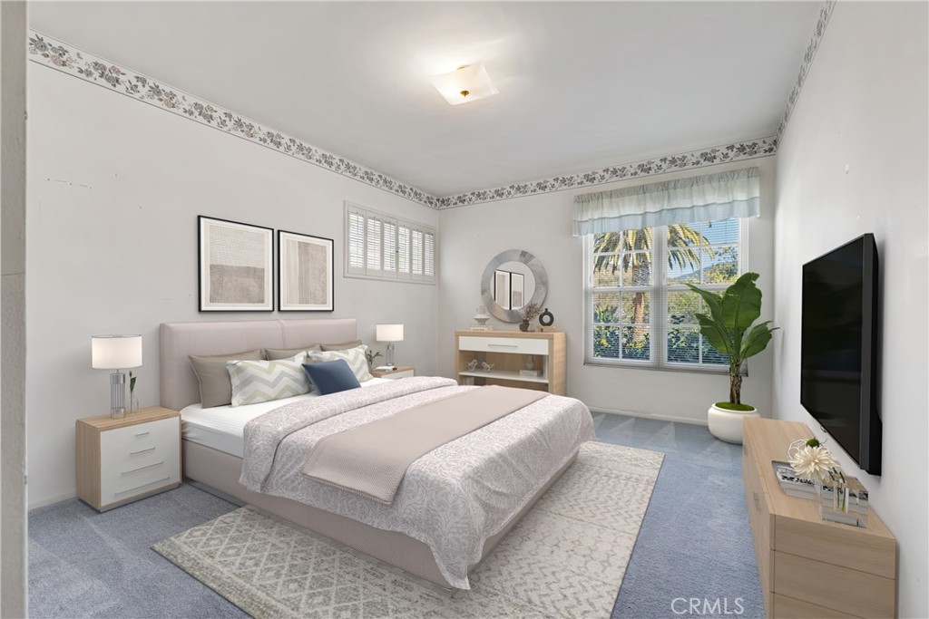 707 Luring Drive Glendale, CA 91206 - Photo 16 of 25 a bedroom with a large bed and a flat screen tv