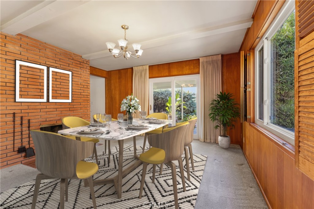 707 Luring Drive Glendale, CA 91206 - Photo 8 of 25 a dining room with furniture a chandelier and wooden floor