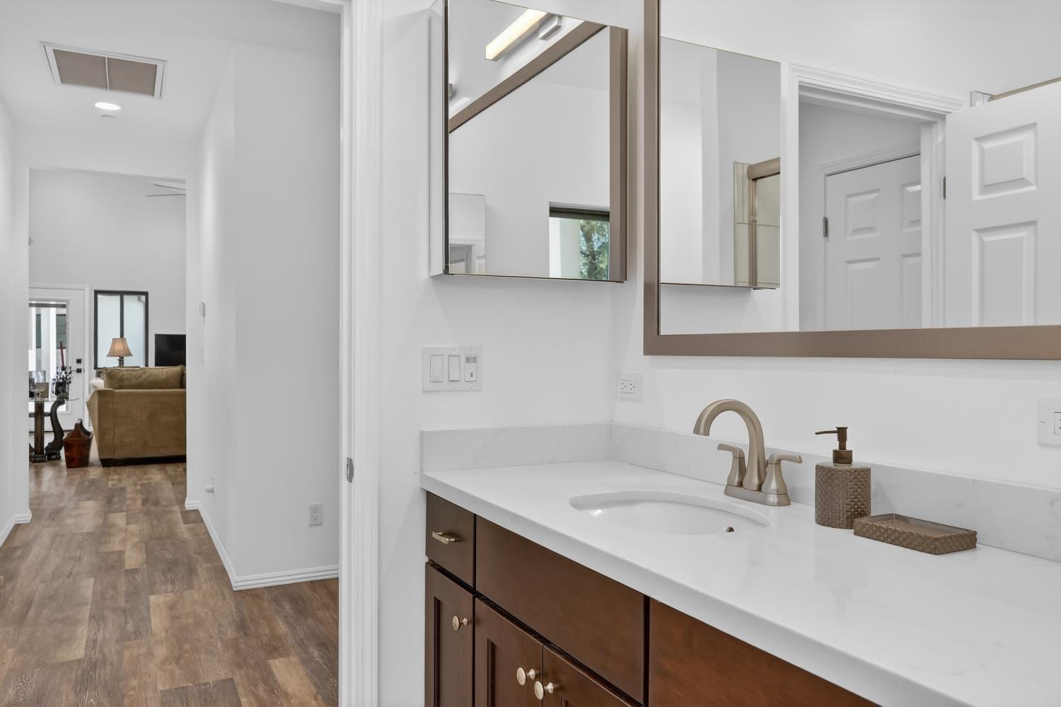 3000 Spring Hill Road Somerset, CA 95684 - Photo 35 of 94 a bathroom with a sink and mirror