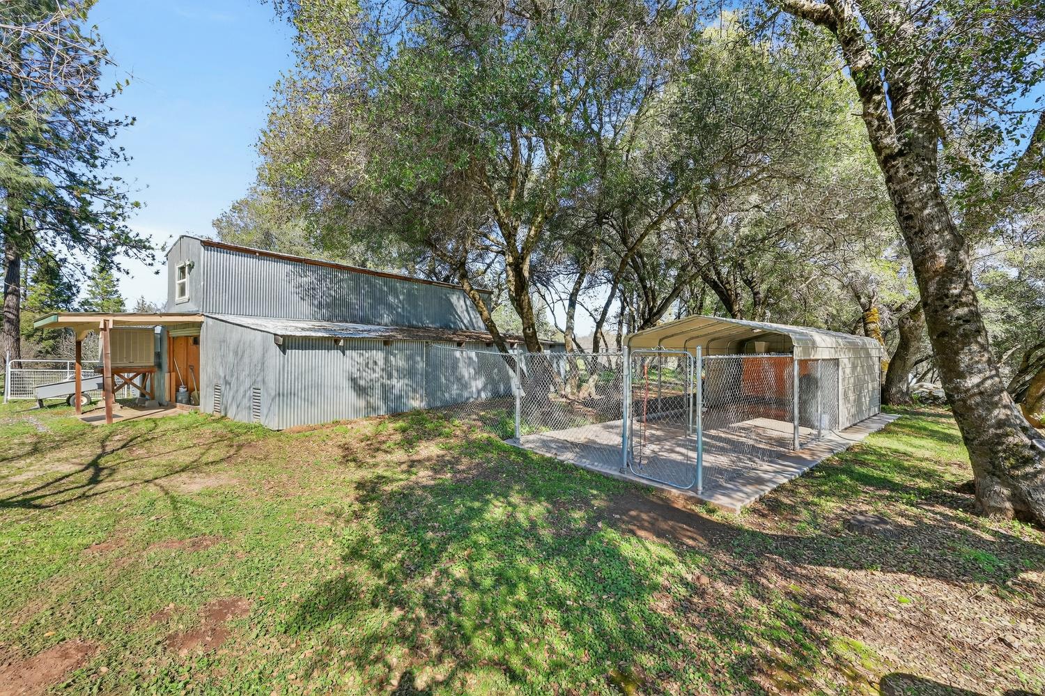 3000 Spring Hill Road Somerset, CA 95684 - Photo 48 of 94 a front view of a house with a yard and large tree