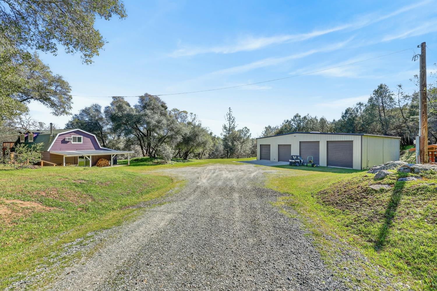 3000 Spring Hill Road Somerset, CA 95684 - Photo 50 of 94 a front view of a house with a garden and yard