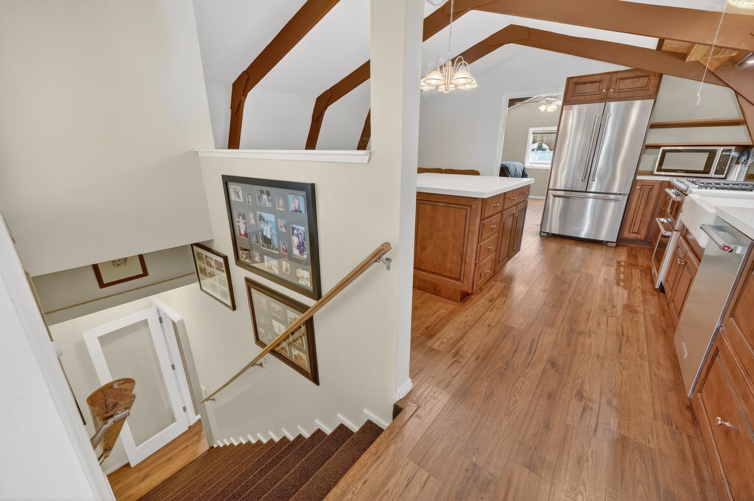 3000 Spring Hill Road Somerset, CA 95684 - Photo 63 of 94 a view of a hallway with wooden floor and staircase