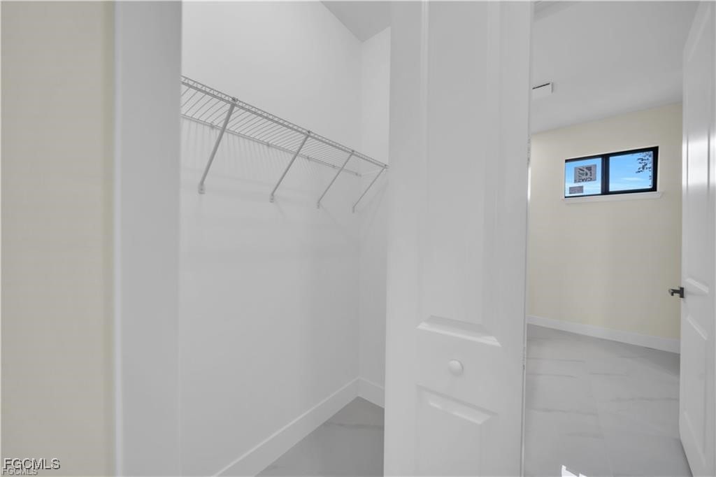 4306 2nd Street Southwest Lehigh Acres, FL 33976 - Photo 17 of 21 a view of a hallway