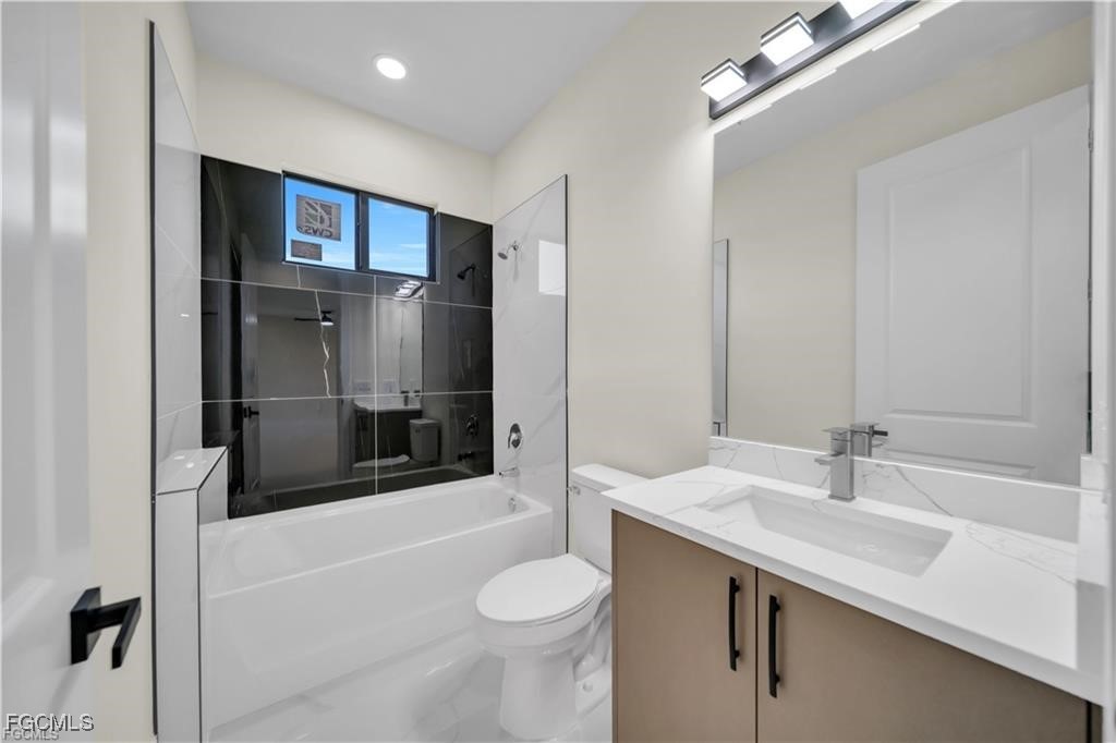 4306 2nd Street Southwest Lehigh Acres, FL 33976 - Photo 8 of 21 a bathroom with a sink toilet and shower