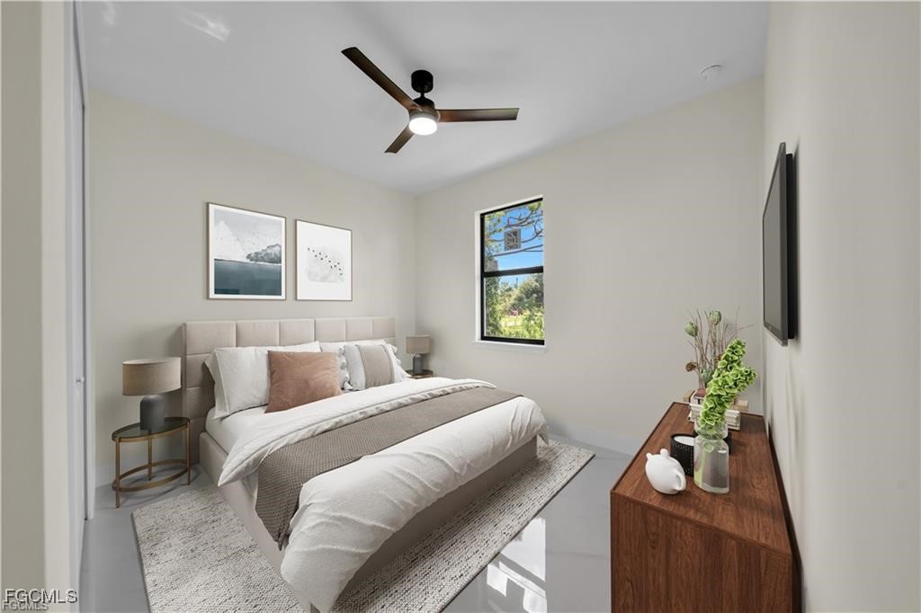 4306 2nd Street Southwest Lehigh Acres, FL 33976 - Photo 9 of 21 a bedroom with a bed furniture and a window