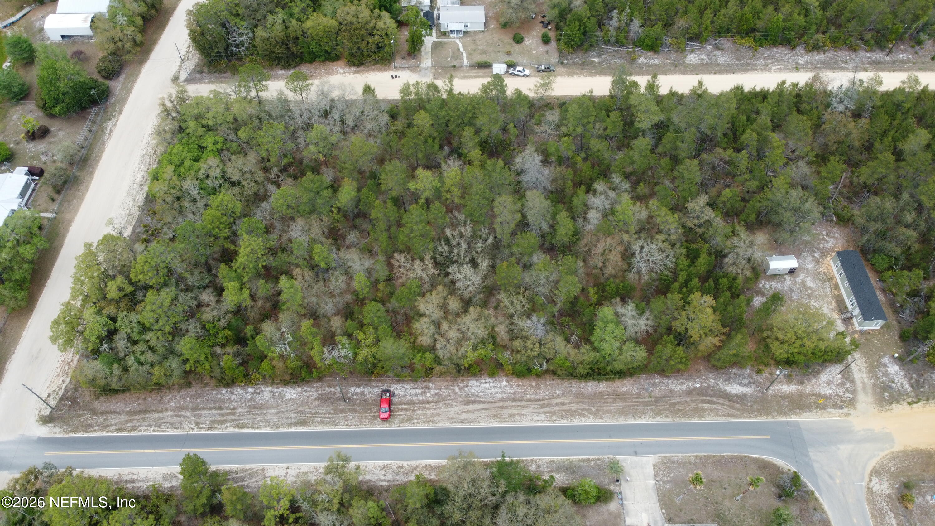 0 Wallace Street Interlachen, FL 32148 - Photo 2 of 8 a view of street with green space