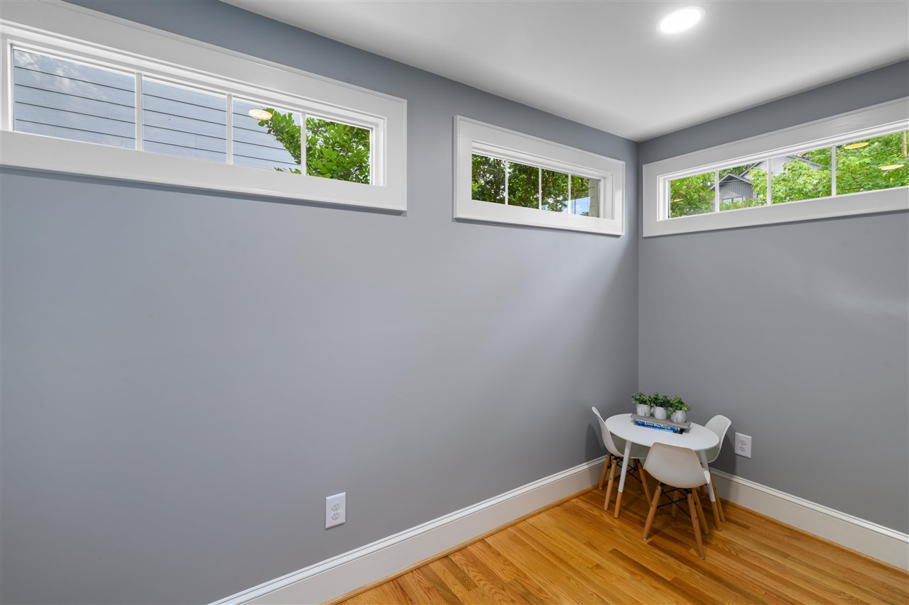 2618 Van Dyke Avenue Raleigh, NC 27607 - Photo 20 of 30 The second of two bedrooms on the main level has high, rectangular windows to allow light and maximize privacy. Bedroom