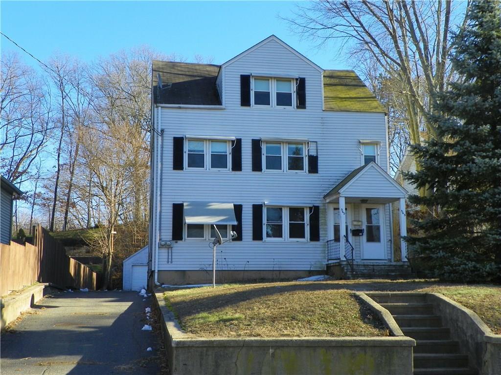 a view of a house with swimming pool and sitting area
