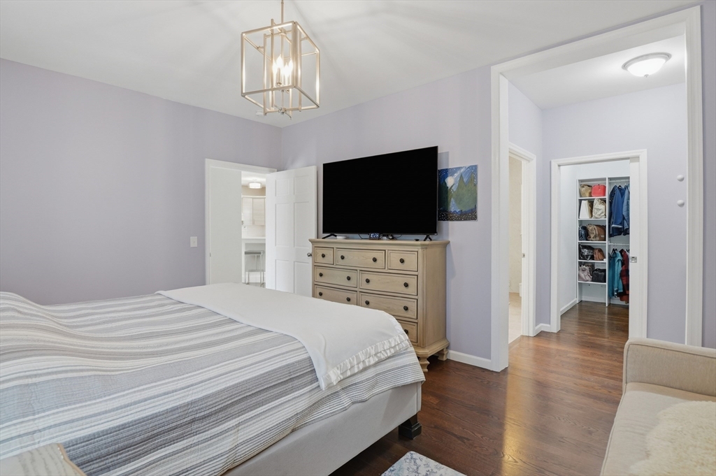 112 Pineland Avenue Worcester, MA 01604 - Photo 32 of 38 a bedroom with a bed and a flat screen tv