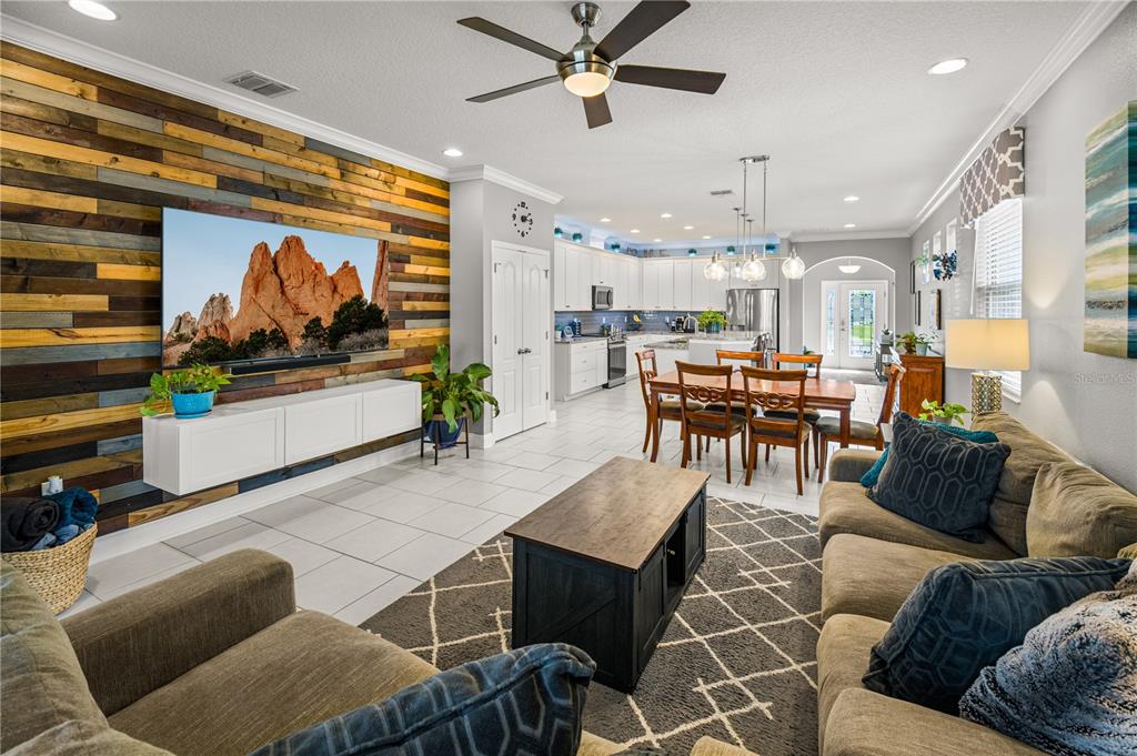 5196 Appenine Loop East St. Cloud, FL 34771 - Photo 13 of 39 a living room with furniture and a flat screen tv