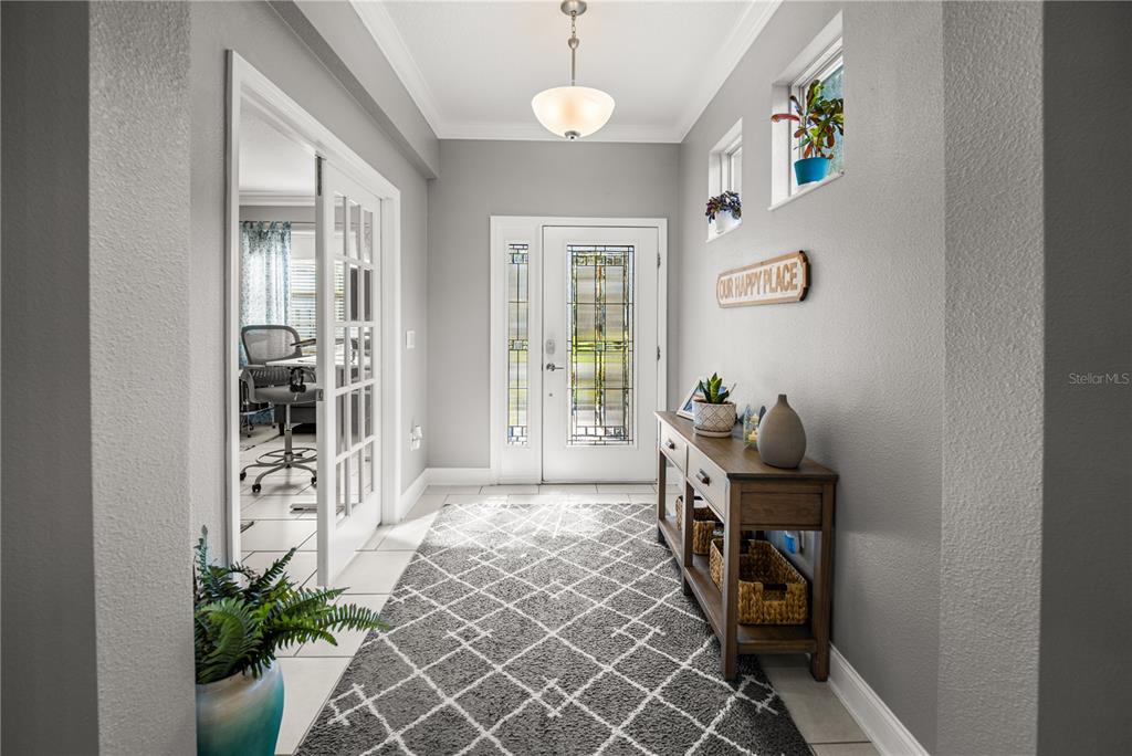 5196 Appenine Loop East St. Cloud, FL 34771 - Photo 3 of 39 a view of a hallway to a livingroom with furniture
