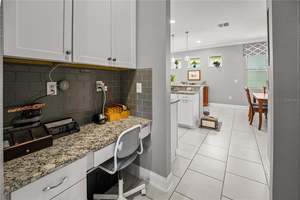 5196 Appenine Loop East St. Cloud, FL 34771 - Photo 9 of 39 a kitchen with a sink a stove and cabinets
