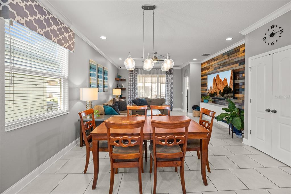 5196 Appenine Loop East St. Cloud, FL 34771 - Photo 10 of 39 a view of a dining room with furniture and window