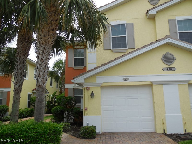 4381 Lazio Way, Unit 501 Fort Myers, FL 33901 - Photo 1 of 25 a view of a house with a swimming pool