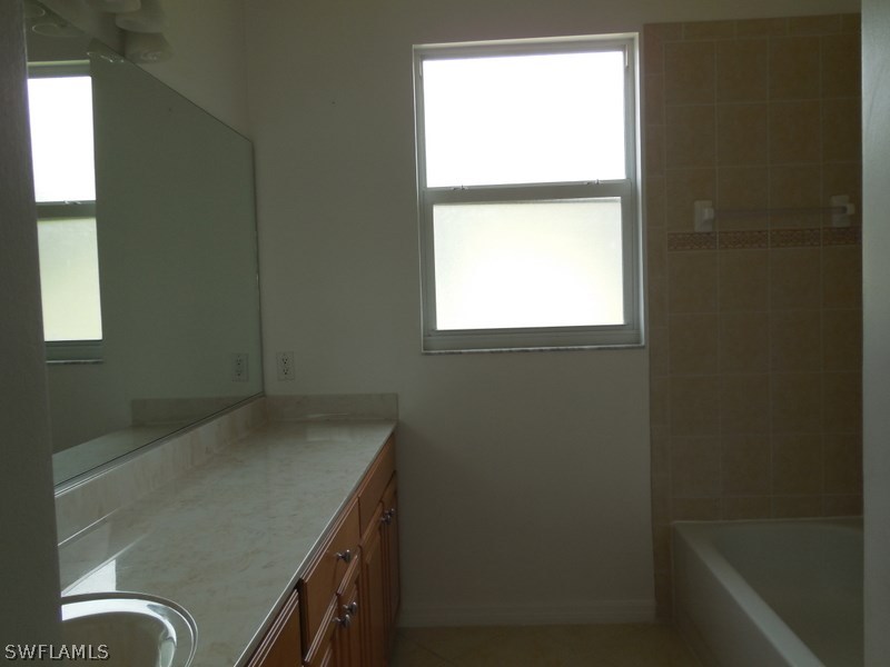 4381 Lazio Way, Unit 501 Fort Myers, FL 33901 - Photo 17 of 25 a view of storage and utility room with window