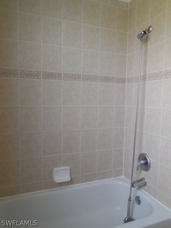 4381 Lazio Way, Unit 501 Fort Myers, FL 33901 - Photo 18 of 25 a bathroom with a shower