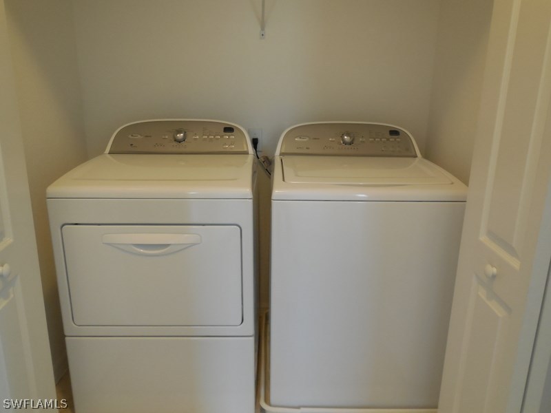 4381 Lazio Way, Unit 501 Fort Myers, FL 33901 - Photo 19 of 25 a utility room with dryer and washer