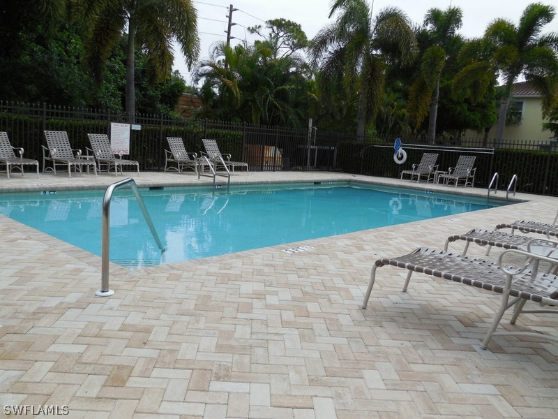4381 Lazio Way, Unit 501 Fort Myers, FL 33901 - Photo 23 of 25 a view of a swimming pool with a patio