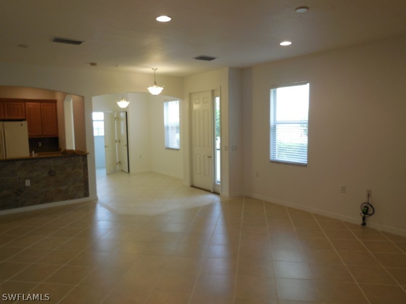 4381 Lazio Way, Unit 501 Fort Myers, FL 33901 - Photo 5 of 25 a view of a hallway with wooden floor
