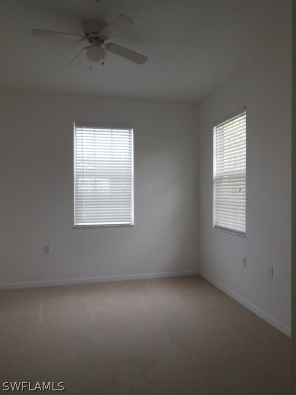 4381 Lazio Way, Unit 501 Fort Myers, FL 33901 - Photo 10 of 25 an empty room with a window