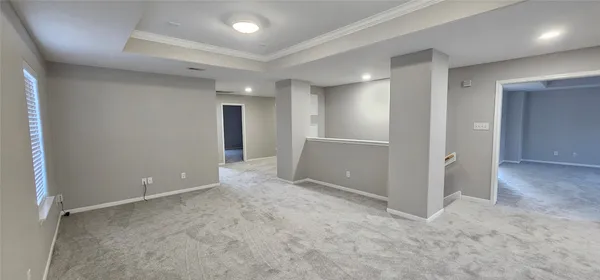 an empty room with closet and wooden door