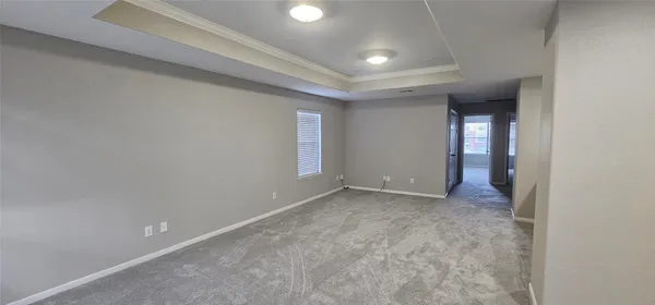 a spacious bathroom with a granite countertop sink a toilet and a mirror