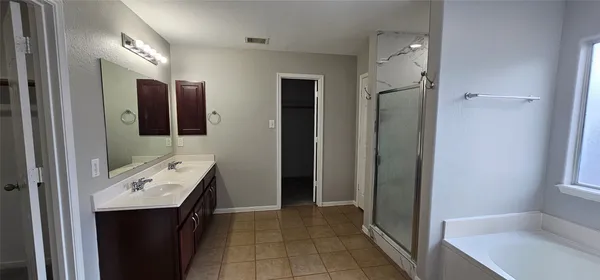 a bathroom with a sink toilet and mirror