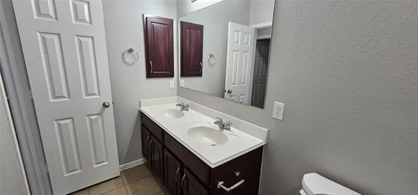 a view of a brick house with a backyard