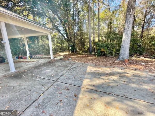 a view of backyard with green space