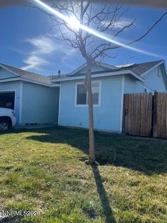 a view of a backyard of the house