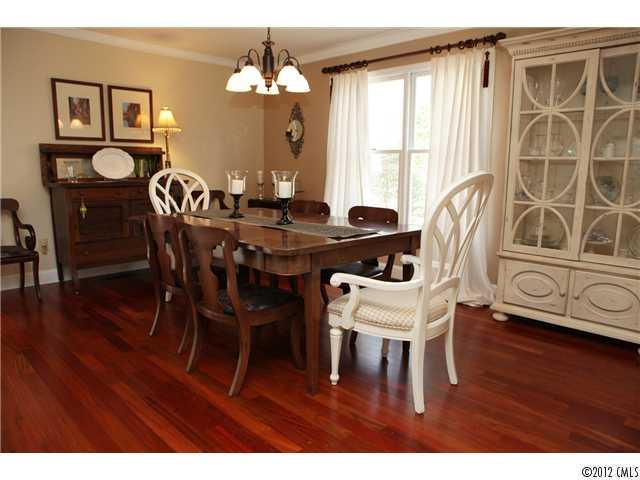 3096 Point Clear Drive Tega Cay, SC 29708 - Photo 8 of 16 a view of a dining room with furniture window and wooden floor