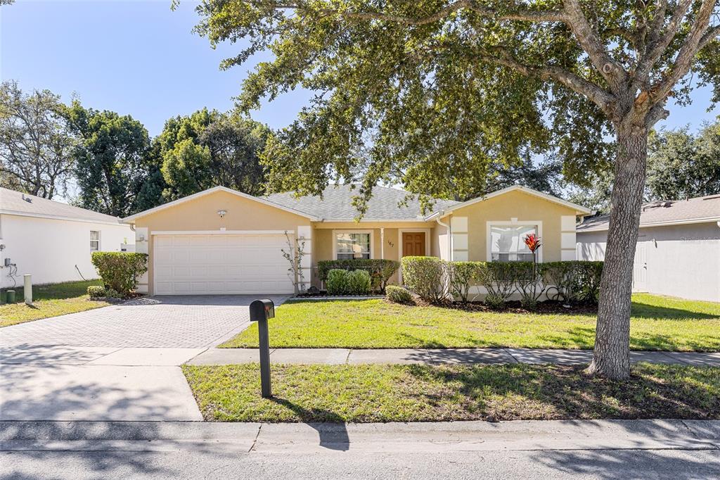 a front view of a house with a yard