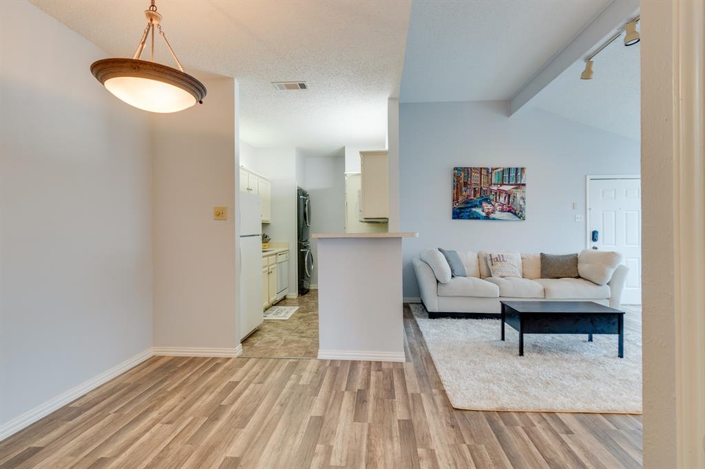 2100 Randy Snow Road, Unit 412 Arlington, TX 76011 - Photo 26 of 32 a living room with furniture and a wooden floor