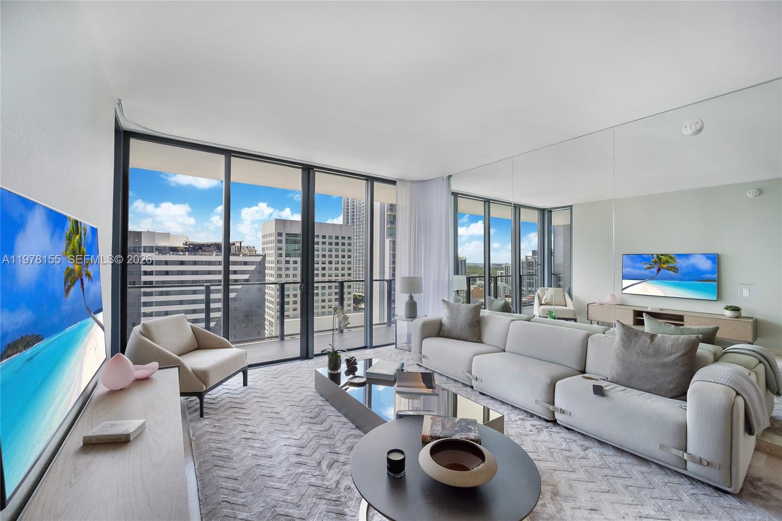 a living room with furniture and a floor to ceiling window