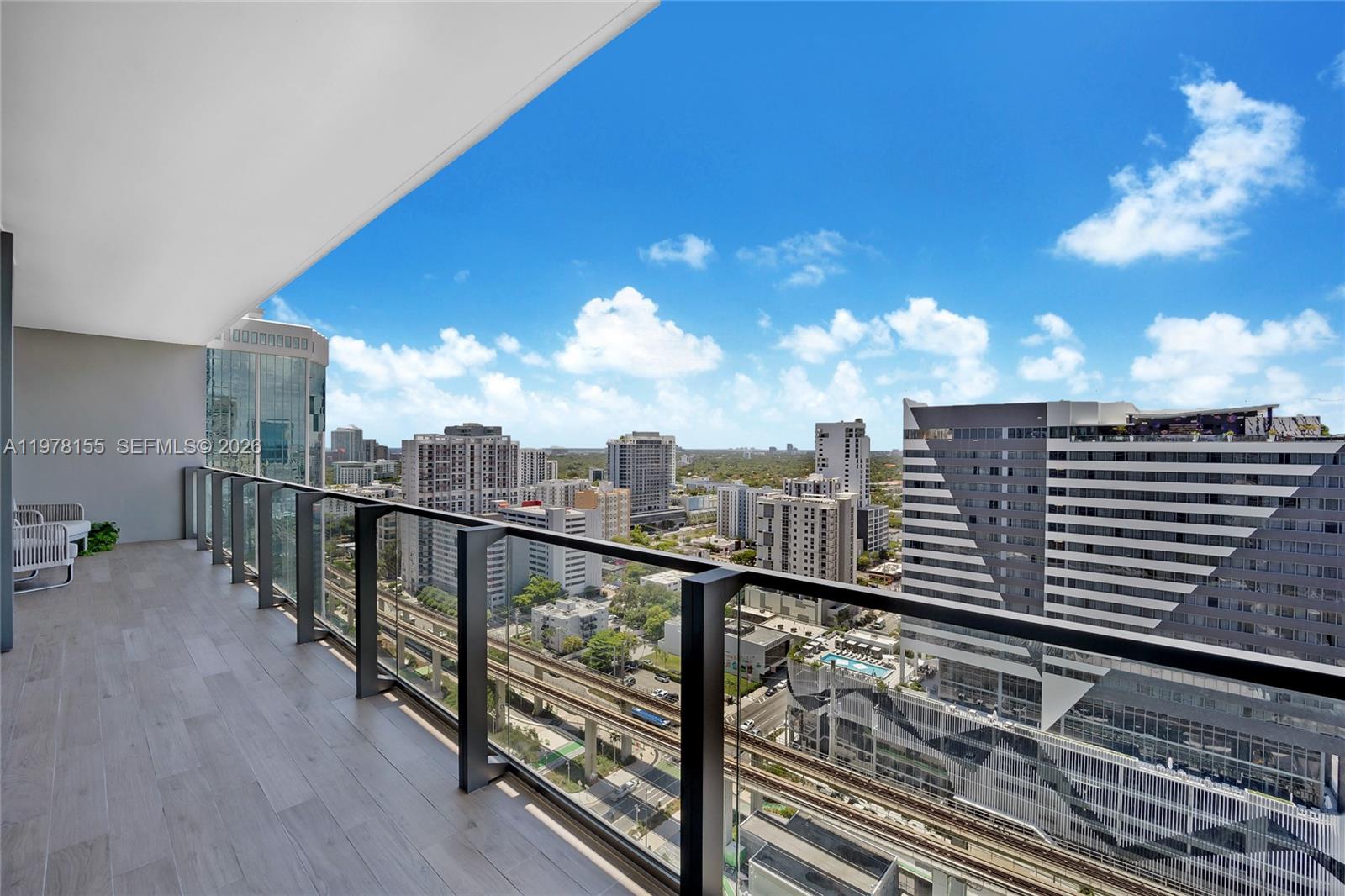 88 Southwest 7th Street, Unit 1810 Miami, FL 33130 - Photo 11 of 13 a view of a balcony with city view