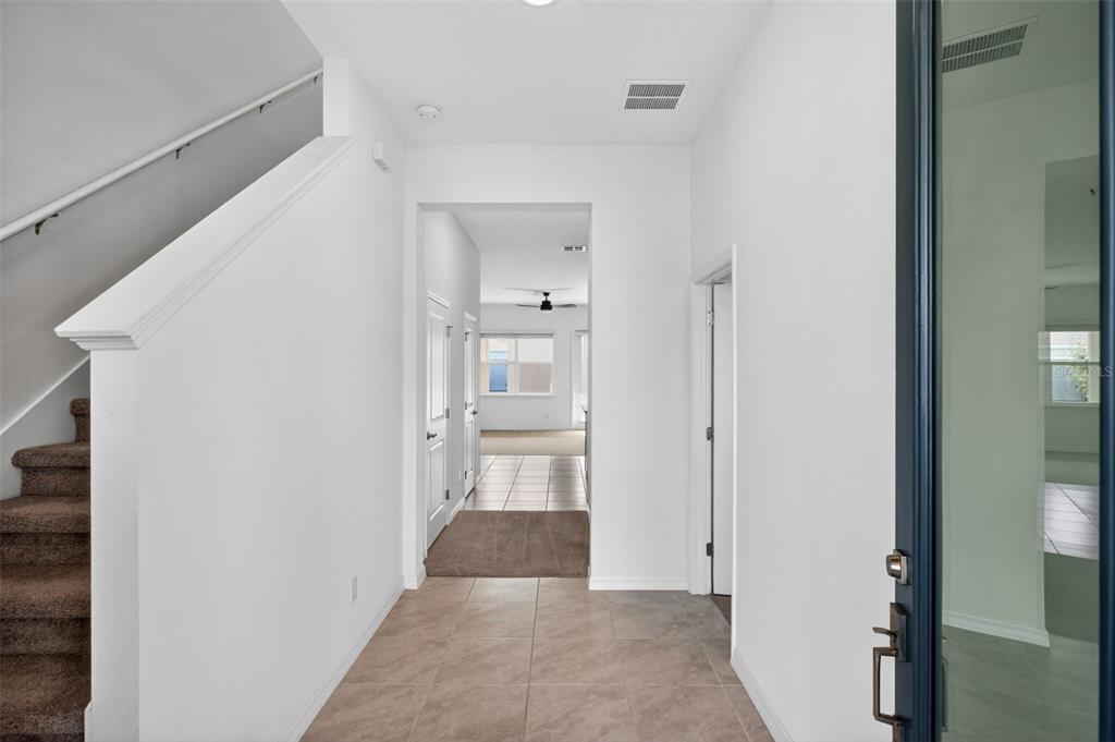 810 MIDDLETON Street DeBary, FL 32713 - Photo 19 of 52 a view of a hallway with wooden shelves