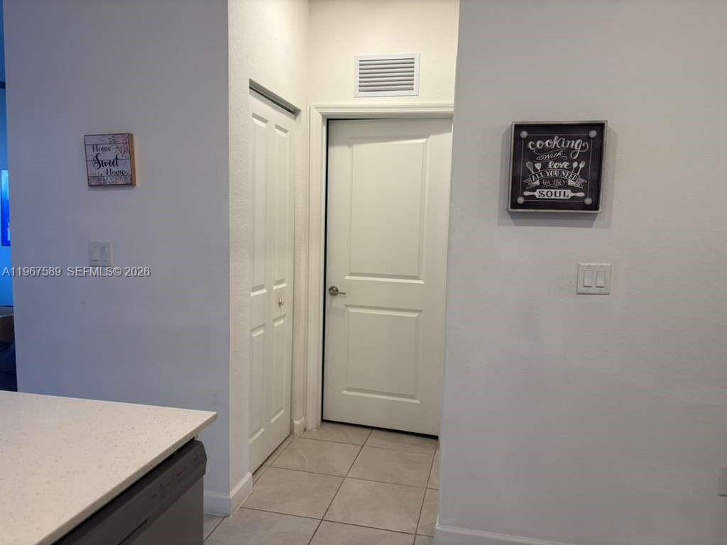13043 Southwest 286th Street Homestead, FL 33033 - Photo 18 of 34 a view of a hallway to rooms