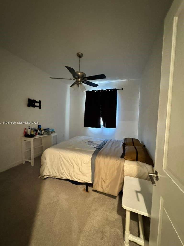 13043 Southwest 286th Street Homestead, FL 33033 - Photo 21 of 34 a bedroom with a bed and a walk in closet