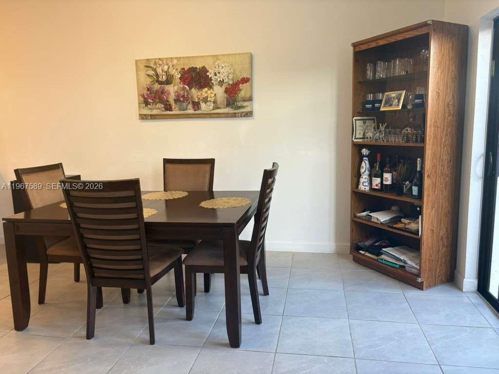 13043 Southwest 286th Street Homestead, FL 33033 - Photo 7 of 34 a view of a dining room with furniture