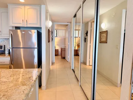 a view of a kitchen with a refrigerator and a refrigerator