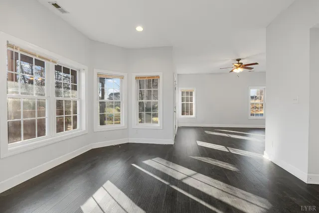 a view of balcony with wooden floor and fence