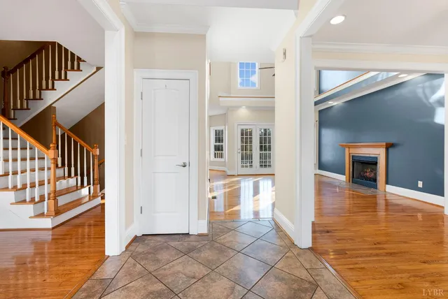 a view of a hallway view with wooden floor and staircase