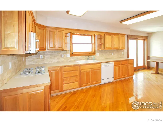 a bathroom with a sink and a refrigerator
