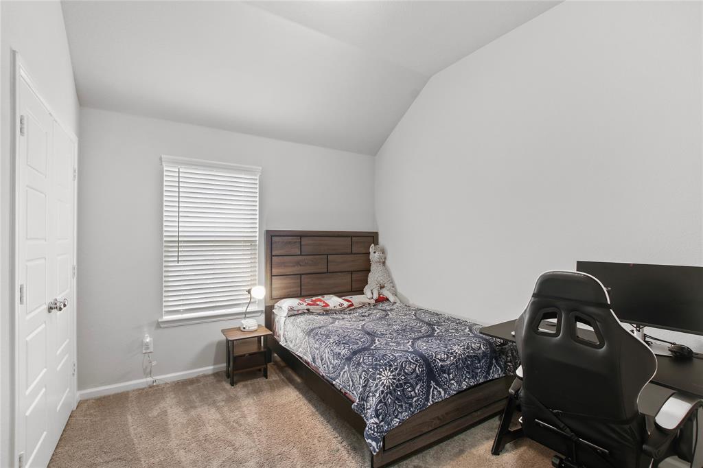 1613 Wayback Drive Celina, TX 75009 - Photo 18 of 35 a bedroom with a bed and windows