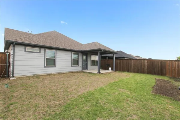 a house with yard in front of it