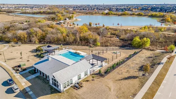 an aerial view of a house with a lake view