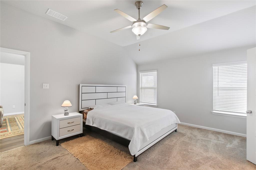 1613 Wayback Drive Celina, TX 75009 - Photo 4 of 35 a bedroom with a bed and a chandelier